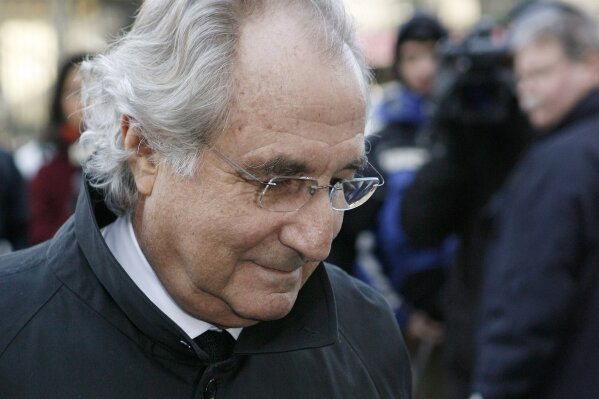 FILE - In this Jan. 14, 2009 file photo, Bernard Madoff arrives at Federal Court in New York. On Thursday, Sept. 24, 2020, a federal appeals court said that investors who profited from Madoff's massive Ponzi scheme must pay back their profits even if they knew nothing of it. Madoff is serving a 150-year prison sentence imposed after he pleaded guilty to federal charges in 2009. (AP Photo/Stuart Ramson, File)