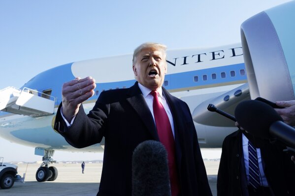 President Donald Trump speaks to the media before boarding Air Force One, at Andrews Air Force Base, Md. The President is traveling to Texas. (AP Photo/Alex Brandon)