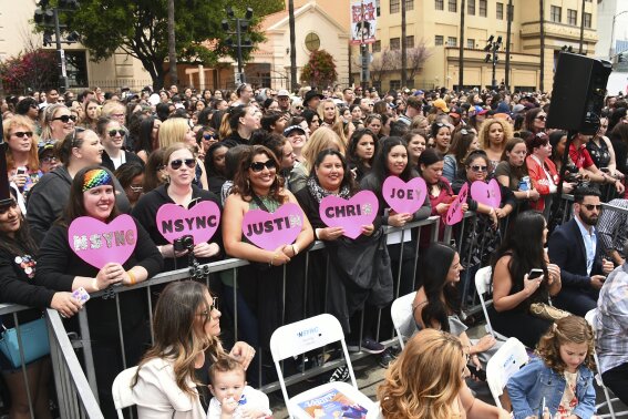 Fans attend a ceremony honoring NSYNC with a star on the Hollywood Walk of Fame in Los Angeles. (Photo by Jordan Strauss/Invision/AP)