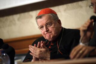 FILE - In this Sept. 6, 2018 file photo, Cardinal Raymond Burke applauds during a news conference at the Italian Senate, in Rome. Cardinal Burke, a top-ranking Roman Catholic cardinal says he will soon begin rehabilitation after contracting COVID-19. Cardinal Raymond Burke is one of the church's most outspoken conservatives and a COVID-19 vaccine skeptic. He tweeted on Aug. 10 that he had contracted the disease. He was sedated and placed on a ventilator. (AP Photo/Alessandra Tarantino, File)