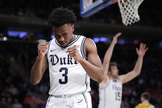 Duke's Jeremy Roach (3) reacts after scoring and drawing a foul during the first half of the team's NCAA college basketball game against Iowa in the Jimmy V Classic, Tuesday, Dec. 6, 2022, in New York. (AP Photo/John Minchillo)