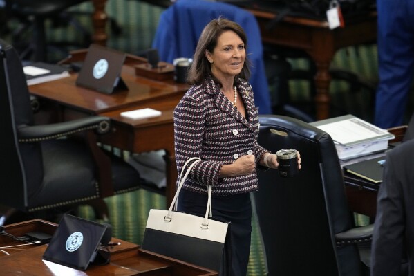 State Sen. Angela Paxton, R-McKinney, enters the Senate Chamber for the impeachment trial for Texas Attorney General Ken Paxton, her husband, at the Texas Capitol, Wednesday, Sept. 13, 2023, in Austin, Texas. (AP Photo/Eric Gay)