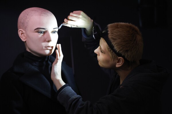 In this undated handout photo provided by The National Wax Museum Plus, Artistic Coordinator Mel Creek applies the finishing touches on a wax figure of the late singer Sinead O'Connor, at the National Wax Museum Plus on Dublin's Westmorland Street, Ireland. A wax figure of Sinéad O’Connor that did not compare to how the late singer looked caused a minor meltdown among fans and family members, leading a Dublin museum on Friday, July 26, 2024, to pull it from its collection. The National Wax Museum Plus apologized to O'Connor's family and said it would aim to create a more accurate representation of the singer of “Nothing Compares 2 U.” (Julien Behal via ĢӰԺ)