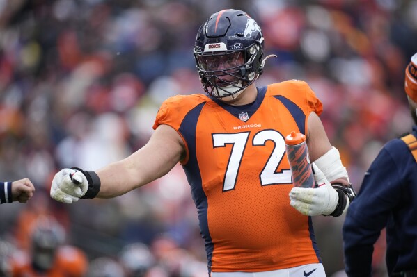 FILE - Denver Broncos offensive tackle Garett Bolles takes the field in the second half of an NFL football game Sunday, Oct. 29, 2023, in Denver. Bolles has become a mentor for more than 100 children and teens teetering on the brink of serious trouble. Bolles was once that troubled kid. (AP Photo/David Zalubowski, File)