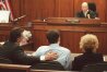 Attorney Barry Levin, left, defendant Erik Menendez, center, and attorney Leslie Abramson listen as the verdicts are read at the Van Nuys Superior Court in Los Angeles, Wednesday, March 20, 1996. Erik Mendendez and his brother Lyle were found guilty of first-degree murder and conspiracy for the 1989 shotgun murders of their parents Kitty and Jose Menendez. In the background is Superior Court Judge Stanley Weisberg. (AP Photo/Hans Gutknecht, Pool)