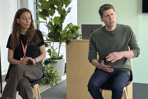 Sam Altman, right, then CEO of ChatGPT maker OpenAI, and Mira Murati, chief technology officer, appear at OpenAI DevDay, OpenAI's first developer conference, on Monday, Nov. 6, 2023 in San Francisco. The board of Open AI says it has pushed out Altman and appointed Murati as interim CEO role effective immediately. (AP Photo/Barbara Ortutay)