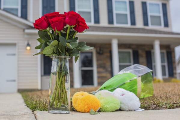 FILE - A memorial sits outside a home on Whitetail Circle in Sumter, S.C., on Wednesday, March 22, 2023. A 42-year-old former soldier shot and killed three children as they slept in their home while their mother frantically sought help, authorities said. He also killed an Army soldier who was at the home before killing himself. The shooter and the children's mother were divorced. (Cal Cary/The Item via AP, File)