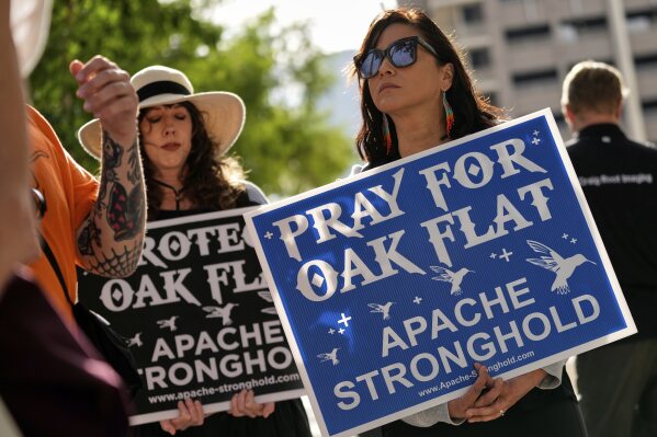 Members of Apache and others who want to halt a massive copper mining project on federal land in Arizona gather outside the U.S. District Court, May 7, 2025, in Phoenix. (AP Photo/Matt York, File)