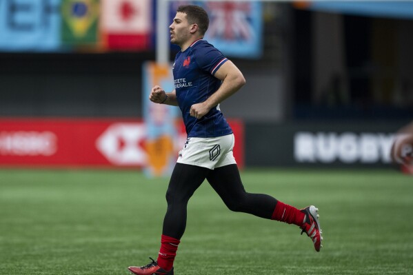 France's Antoine Dupont runs onto the pitch during the team's Vancouver Sevens rugby match against the United States on Friday, Feb. 23, 2024, in Vancouver, British Columbia. (Ethan Cairns/The Canadian Press via AP)