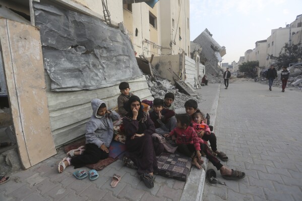 Palestinians fleeing the Israeli bombardment of the Gaza Strip arrive in Rafah Wednesday, Dec. 27, 2023. (AP Photo/Hatem Ali)