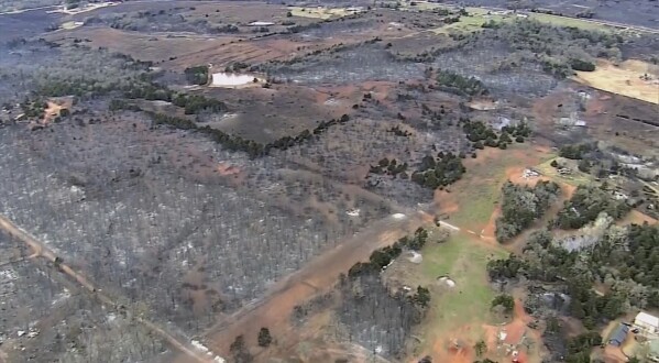 This image provided by shows aerials over the damage caused by the wildfires in Logan County, Okla. (KOCO via AP)