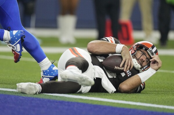 Cleveland Browns quarterback Joe Flacco falls down after being tackled during the second half of an NFL football game against the Los Angeles Rams Sunday, Dec. 3, 2023, in Inglewood, Calif. (AP Photo/Mark J. Terrill)