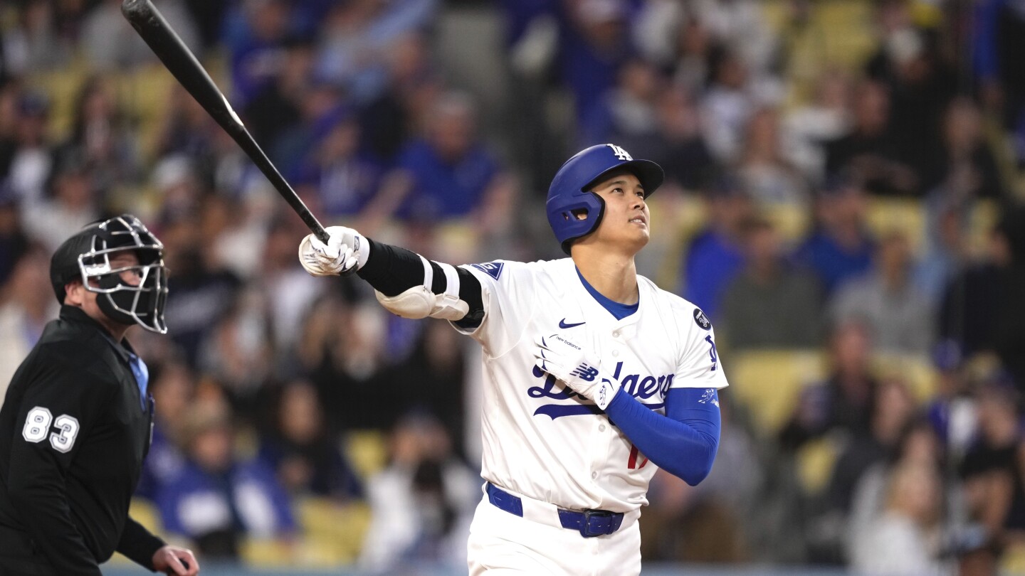 Ohtani hits 448-foot homer in 7-run 1st inning, Dodgers hold on for 8-7 win to sweep Rockies