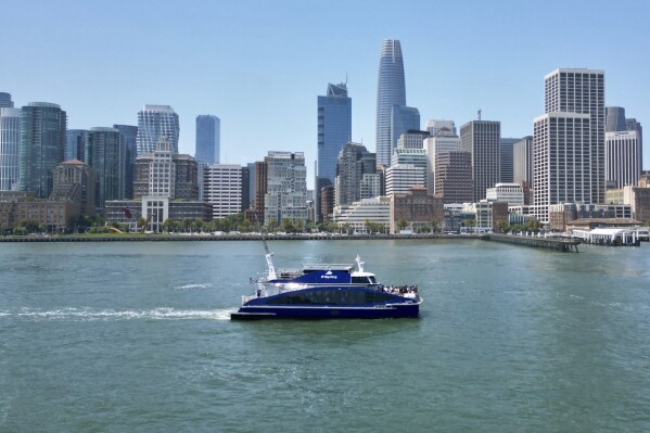 The MV Sea Change, the first commercial passenger ferry powered by hydrogen fuel cells, is seen on the water, Friday, July 12, 2024, in San Francisco. The MV Sea Change will begin offering free rides to the public along the San Francisco waterfront on Friday, July 19. (AP Photo/Terry Chea)
