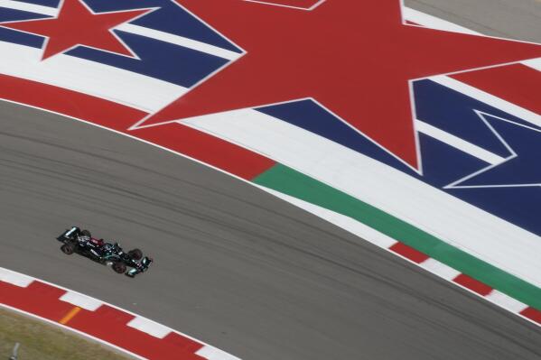 Mercedes driver Lewis Hamilton, of Britain, moves into a turn during a practice session for the F1 US Grand Prix auto race at Circuit of the Americas, Friday, Oct. 22, 2021, in Austin, Texas. (AP Photo/Nick Didlick)