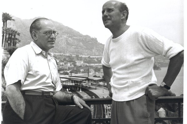 This image released by Cohen Media Group shows Emeric Pressburger, left, and Michael Powell on the set of "The Red Shoes." (Cohen Media Group via AP)