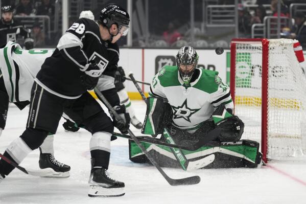 Dallas Stars goaltender Scott Wedgewood (41) stops a shot by Los Angeles Kings center Jaret Anderson-Dolan (28) during the second period of an NHL hockey game Thursday, Jan. 19, 2023, in Los Angeles. (AP Photo/Ashley Landis)