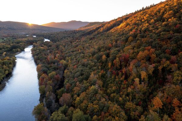 This photo taken Sept. 24, 2023, shows a view of Middle Mountain in Shelburne, N.H., and part of the Androscoggin River. The Society for the Protection of New Hampshire Forests has completed a long-term effort to protect the Shelburne Valley Forest and the Bald Cap Peak Forest in the northern part of the state, for a total of 3,700 acres. (AP via Ryan Smith)