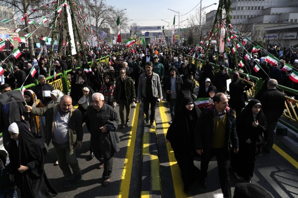 Iranians attend the annual rally commemorating the 1979 Islamic Revolution at the Azadi (Freedom) St. in Tehran, Iran, Sunday, Feb. 11, 2024. Iran marked Sunday the 45th anniversary of the 1979 Islamic Revolution amid tensions gripping the wider Middle East over Israel's continued war on Hamas in the Gaza Strip. (AP Photo/Vahid Salemi)