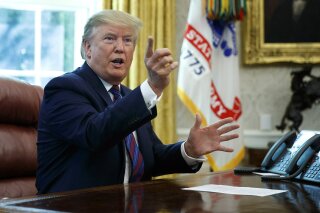 President Donald Trump speaks in the Oval Office of the White House in Washington, Friday, July 26, 2019. Trump announced that Guatemala is signing an agreement to restrict asylum applications to the U.S. from Central America.(AP Photo/Carolyn Kaster)