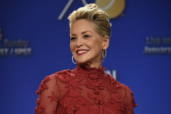 FILE - Sharon Stone poses during the nominations for the 75th Annual Golden Globe Awards on Dec. 11, 2017, in Beverly Hills, Calif. Stone has written a memoir her publisher is calling both candid and comprehensive. Alfred A. Knopf announced Tuesday that Stone's "The Beauty of Living Twice" will be released in March. (Photo by Chris Pizzello/Invision/AP, File)