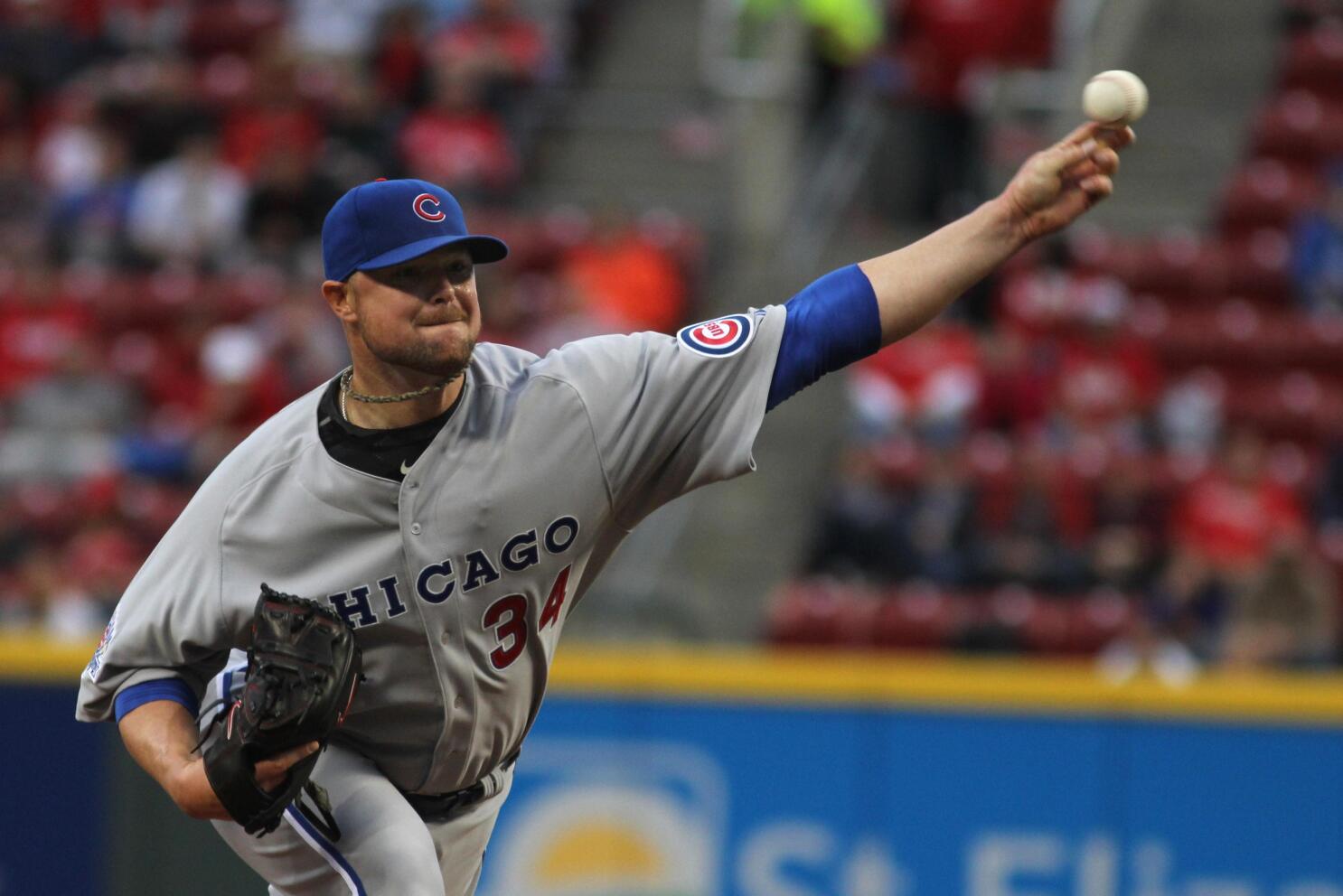 Bryant's Travis Wood takes off his shirt at Cubs rally