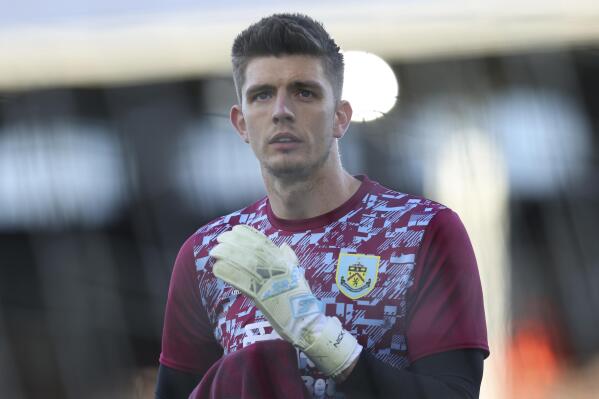 Burnley's goalkeeper Nick Pope warms up ahead of the English Premier League soccer match between Fulham and Burnley at the Craven Cottage Stadium in London, Monday, May 10, 2021. (Catherine Ivill/Pool via AP)