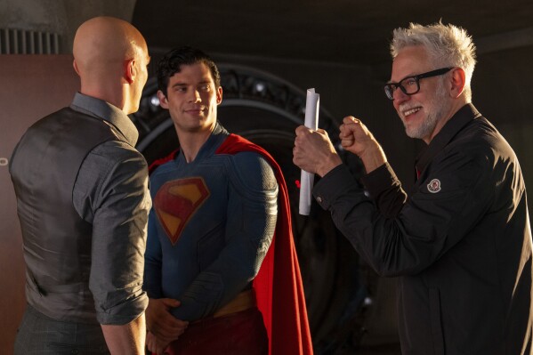 Nicholas Hoult, left, David Corenswet, center, and director James Gunn on the set of "Superman." (Jessica Miglio/Warner Bros. Pictures via AP)