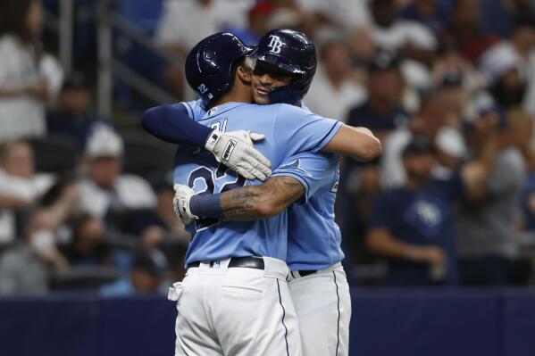 Tampa Bay Rays' Christian Bethancourt, right, embraces teammate Jose Siri after hitting a two-run home run against the New York Yankees during the seventh inning of a baseball game Friday, Sept. 2, 2022, in St. Petersburg, Fla. (AP Photo/Scott Audette)