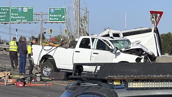 In this file photo provided by KIFI Local News 8, a pickup truck crashed into a passenger van on U.S. Highway 20, Saturday, May 18, 2024, in Idaho Falls, Idaho. The six people killed when a pickup crashed into a passenger van in Idaho over the weekend were agricultural workers from Mexico, officials said. (Jeff Roper/KIFI Local News 8 via AP, File)