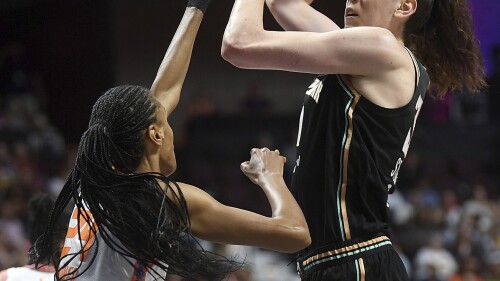 New York Liberty's Breanna Stewart (30) attempts a basket as she is guarded by Connecticut Sun's DeWanna Bonner (24) during the first half of a WNBA basketball game, Tuesday, June 27, 2023 at Mohegan Sun Arena in Uncasville, Conn. (Sarah Gordon/The Day via AP)