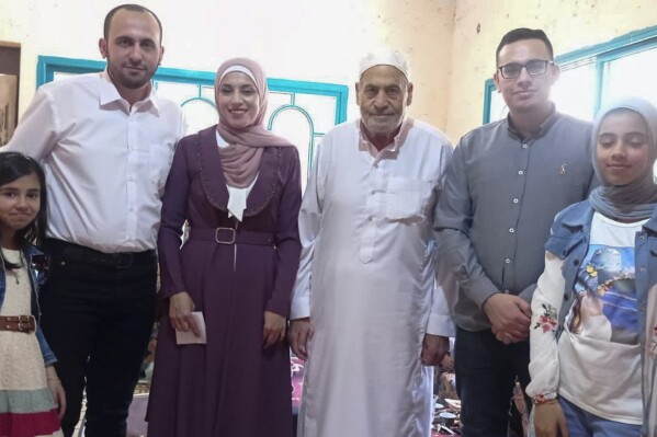 This April 21, 2023 photo provided by Ahmed al-Naouq shows his niece Tala al-Naouq, brother Mohammed al-Naouq, Alaa al-Naouq, his father Nasri al-Naouq, Mahmoud al-Naouq and Dima al-Naouq in Deir Al Balah, Gaza. Entire generations of Palestinian families in the besieged Gaza Strip have been killed in airstrikes in the ongoing Hamas-Israel war. The unprecedented violence has raised troubling questions about Israeli tactics. Ahmed al-Naouq says none of his 21 family members, including 13 children, killed in an Israeli strike on his family's home belonged to Hamas. (Courtesy of Ahmed al-Naouq via AP)