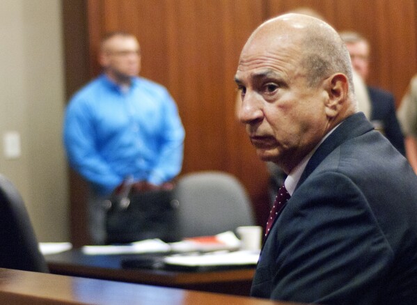 FILE - Coweta Judicial Circuit District Attorney Pete Skandalakis sits in Troup County Superior Court, Aug. 12, 2015, in LaGrange, Ga. A special prosecutor has been assigned to look into whether Georgia Lt. Gov. Burt Jones should face criminal charges over efforts to overturn the 2020 presidential election in the state. The Prosecuting Attorneys' Council of Georgia announced Thursday, April 11, 2024, that Skandalakis, its executive director, will handle the matter. (Tyler H. Jones/The Daily News via AP, File)
