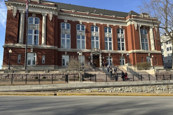 People gather outside the Missouri Supreme Court building on March 12, 2025, in Jefferson City, Mo. (AP Photo/David A. Lieb)