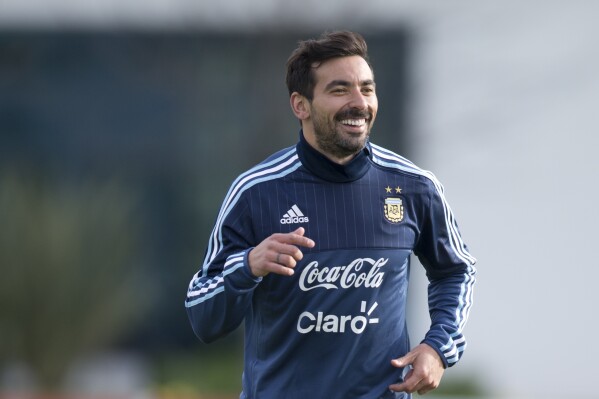 FILE - Argentina's Ezequiel Lavezzi smiles during a training session in Buenos Aires, Argentina, Monday, June 1, 2015. Former Argentine soccer player Ezequiel Lavezzi was hospitalized Wednesday, Dec. 20, 2023, in the beachfront Uruguayan city of Punta del Este with a shoulder blade fracture. A police report obtained by The Associated Press says the 38-year-old Lavezzi was found with the injury at 5 a.m. after he attended a party in his mansion. (AP Photo/Natacha Pisarenko, File)
