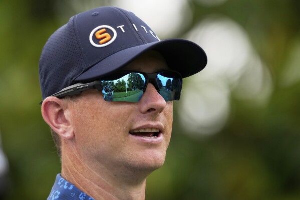 Rupe Taylor watches on the 16th hole during a practice round for the PGA Championship golf tournament at the Quail Hollow Club, Monday, May 13, 2024, in Charlotte, N.C. (AP Photo/David J. Phillip)