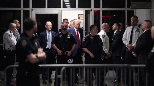 FILE - Former President Donald Trump is escorted to a courtroom, April 4, 2023, in New York. A federal judge has rejected Donald Trump's bid to move his hush-money criminal case from New York state court to federal court. He ruled that the former president had failed to meet a high legal bar for changing jurisdiction. (AP Photo/Mary Altaffer, File)