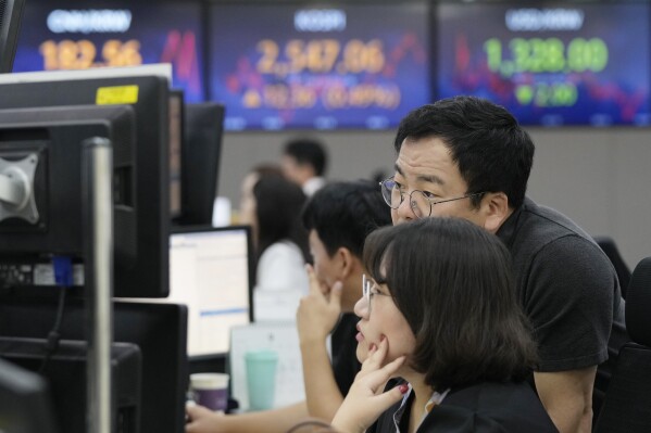 Currency traders watch monitors at the foreign exchange dealing room of the KEB Hana Bank headquarters in Seoul, South Korea, Thursday, Sept. 14, 2023. Shares were mostly higher in Asia on Thursday after a highly anticipated report showed inflation accelerated across the U.S. in August, but not by much more than expected. (AP Photo/Ahn Young-joon)