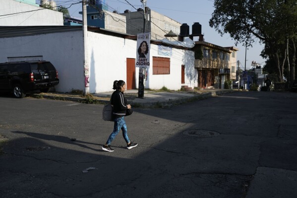 Domestic worker Concepcion Alejo heads to her workplace, in Mexico City, Wednesday, April 24, 2024. Alejo is among approximately 2.5 million Mexicans — largely women — who serve as domestic workers in the Latin American nation. (AP Photo/Marco Ugarte)