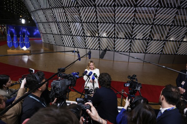 Italy's Prime Minister Giorgia Meloni speaks with the media during an EU Summit at the European Council building in Brussels, Thursday, March 6, 2025. (AP Photo/Omar Havana)
