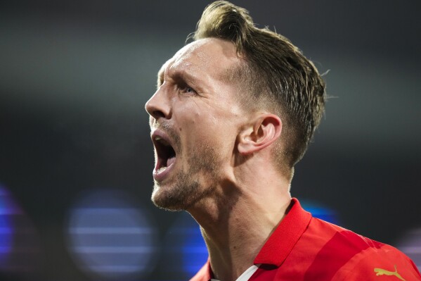 PSV's Luuk de Jong celebrates after scoring his side's first goal during the Champions League round of 16 first leg soccer match between PSV Eindhoven and Borussia Dortmund at Philips stadium in Eindhoven, Netherlands, Tuesday, Feb. 20, 2024. (APPhoto/Peter Dejong)