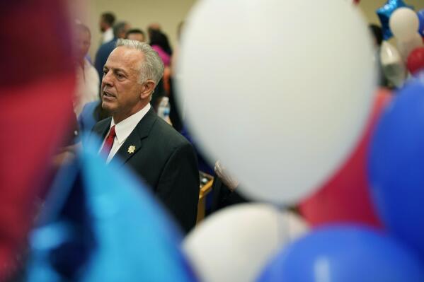 Newly elected sheriff Joe Lombardo,left, and his daughter Morgan