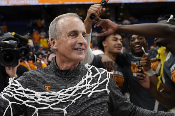 FILE - Tennessee head coach Rick Barnes celebrates after the team defeated Texas A&M during an NCAA men's college basketball Southeastern Conference tournament championship game, Sunday, March 13, 2022, in Tampa, Fla. Tennessee has extended coach Rick Barnes' contract through the 2027-28 season, which should help ensure he finishes his career with the Volunteers. (AP Photo/Chris O'Meara, File)