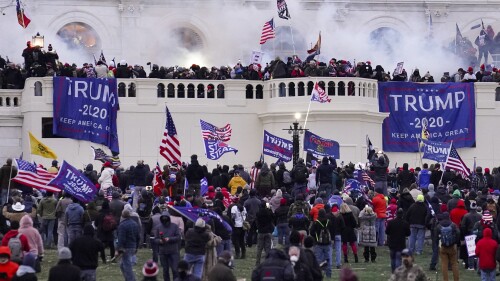 FILE - Violent rioters supporting President Donald Trump storm the Capitol in Washington, Wednesday, Jan. 6, 2021. A former Republican legislative candidate who traveled to Washington for former President Donald Trump's “Stop the Steal” rally was arrested Friday, July 21, 2023, and charged with federal crimes for his role in the U.S. Capitol riot, officials said. (AP Photo/John Minchillo, File)
