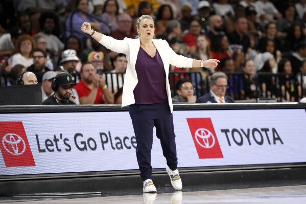 Las Vegas Aces head coach Becky Hammon calls out to players during the first half of an WNBA basketball game against the Minnesota Lynx Tuesday, June 11, 2024, in Las Vegas. (Steve Marcus/Las Vegas Sun via AP)