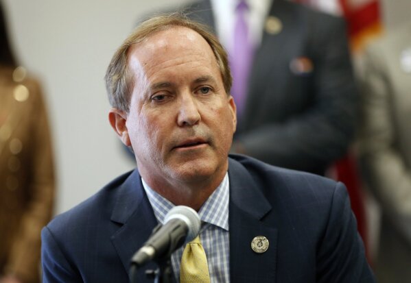 FILE - In this Sept. 10, 2020, file photo, Texas Attorney General Ken Paxton speaks at the Austin Police Association in Austin, Texas.  Paxton had an extramarital affair with a woman whom he later recommended for a job with the wealthy donor now at the center of criminal allegations against him, according to two people who said Paxton told them about the relationship.  (Jay Janner/Austin American-Statesman via AP, File)