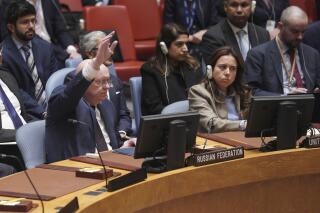 Russian Ambassador to the United Nations Vasily Nebenzya raises his hand against a U.N. Security Council vote on a draft resolution sanctioning Russia's planned annexation of war-occupied Ukraine territory, Friday Sept. 30, 2022 at U.N. headquarters. (AP Photo/Bebeto Matthews)