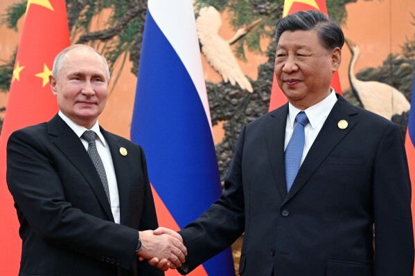 FILE - Chinese President Xi Jinping, right, and Russian President Vladimir Putin pose prior to their talks on the sidelines of the Belt and Road Forum in Beijing, China, on Oct. 18, 2023. Putin is traveling to China on Thursday on his first foreign trip as he starts his fifth term, a visit that underlines an increasingly close partnership between Moscow and Beijing. (Sergei Guneyev, Sputnik, Kremlin Pool Photo via A, File)