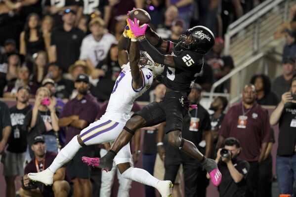 Texas A&M defensive back Dalton Brooks (25) breaks up a pass in the end zone intended for LSU wide receiver Chris Hilton Jr. (3) during the first half of an NCAA college football game Saturday, Oct. 26, 2024, in College Station, Texas. (AP Photo/Sam Craft)