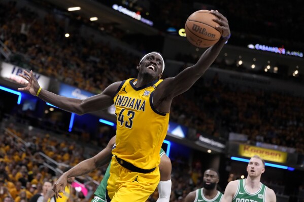 Indiana Pacers forward Pascal Siakam (43) grabs a rebound during the second half of Game 4 of the NBA Eastern Conference basketball finals against the Boston Celtics, Monday, May 27, 2024, in Indianapolis. (AP Photo/Michael Conroy)